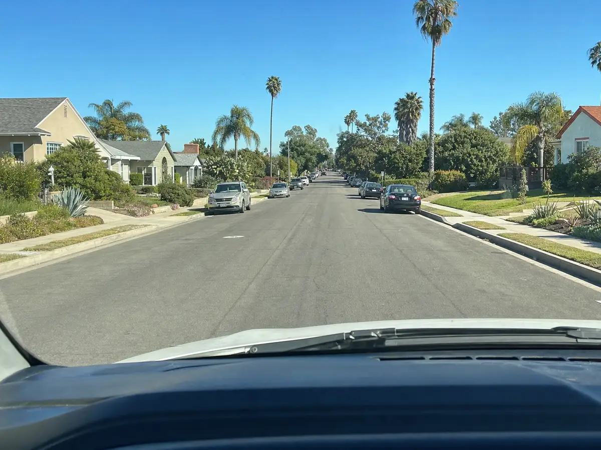 Service van arriving on a Hermosa Beach, CA street — local same-day coverage